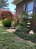 Statuary, dry river bed, bridge and Tamukeyama Japanese Maple