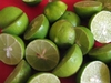 Green limes cut in half. Seeds are present.
