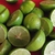 Green limes cut in half. Seeds are present.
