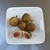 Plate of figs; one cut in half to show pink interior.