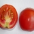 Longi-section of a cherry tomato showing seeds.
